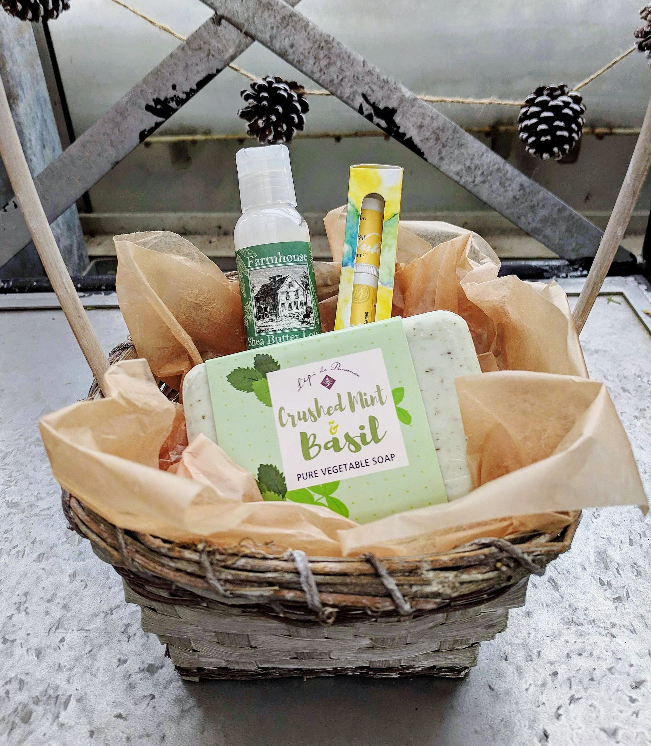 body care items like lotion, soap, lip care in a basket