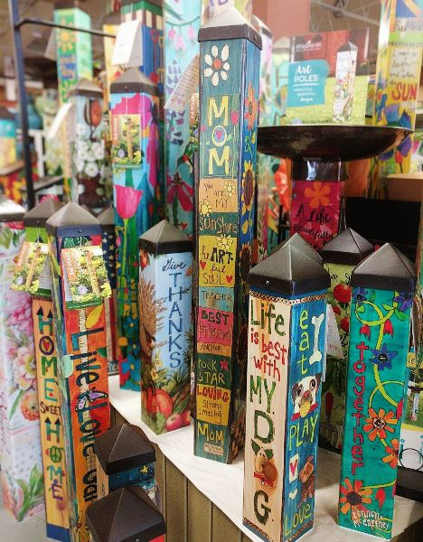 Various art poles with colorful illustrations for your garden